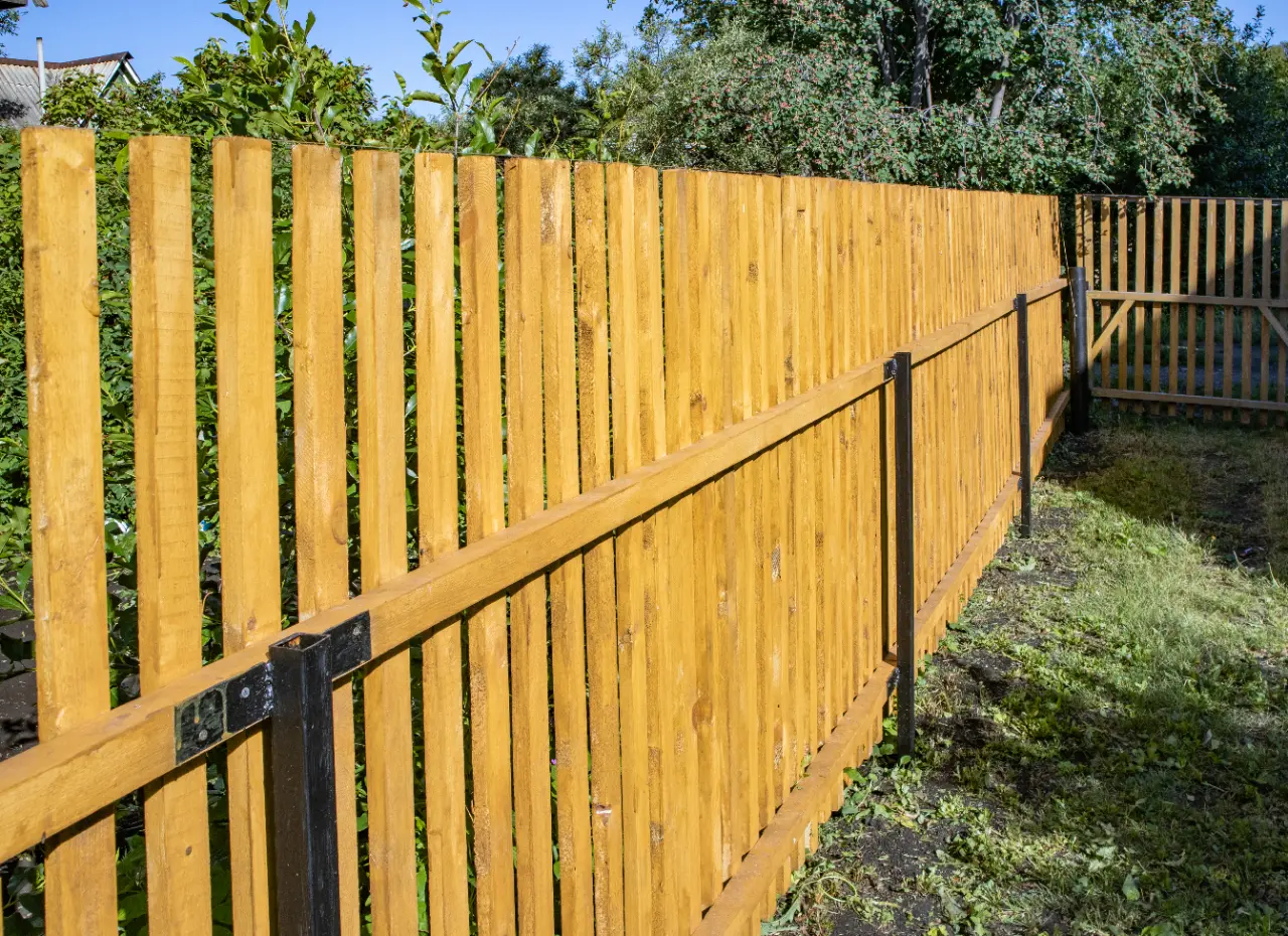 New wooden picket fence in a New Jersey backyard
