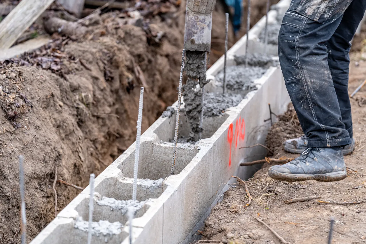 Pouring concrete for a retaining wall footing in New Jersey