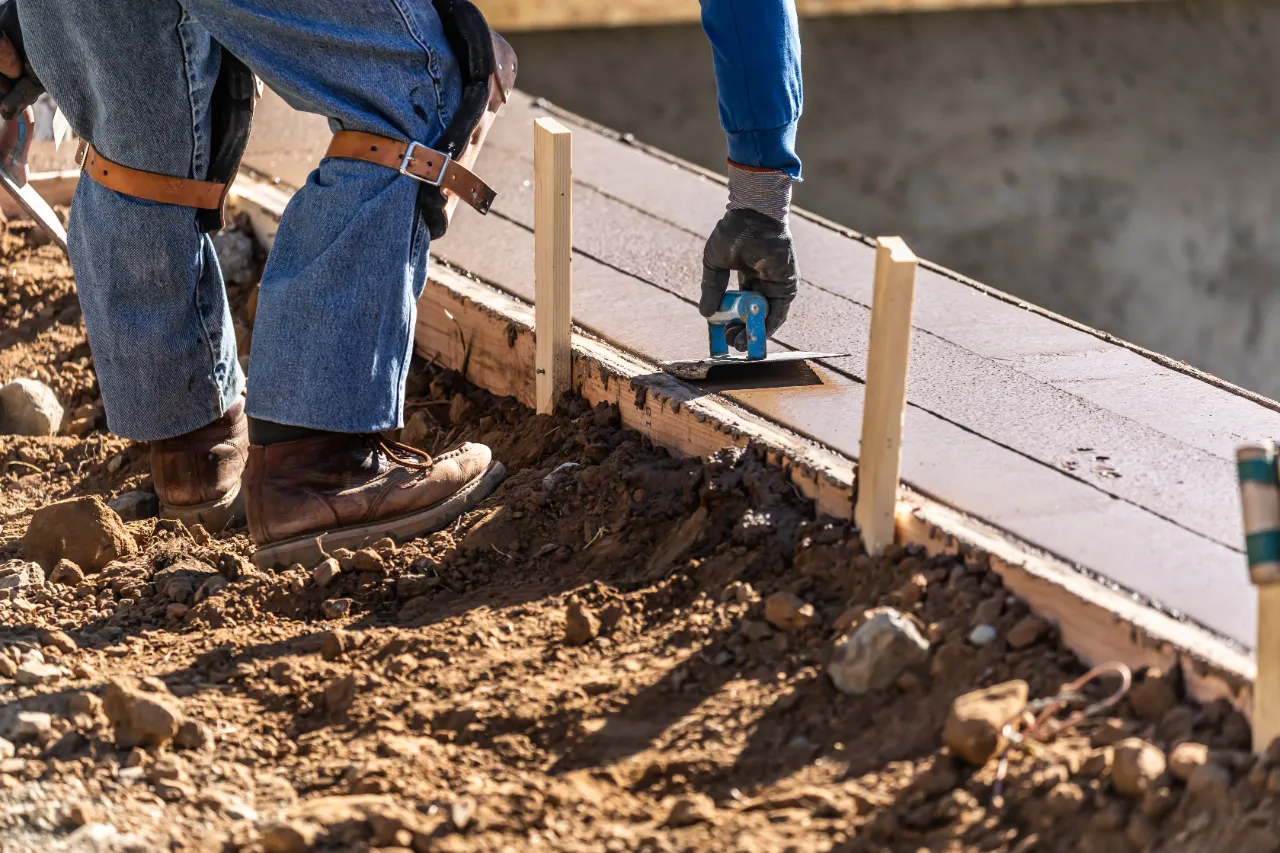 Finishing concrete on a New Jersey retaining wall project
