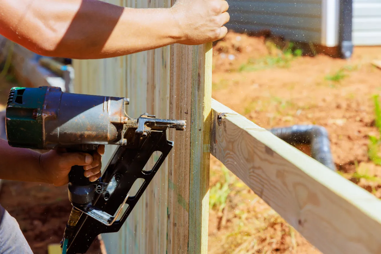 Craftsman building a fence in New Jersey
